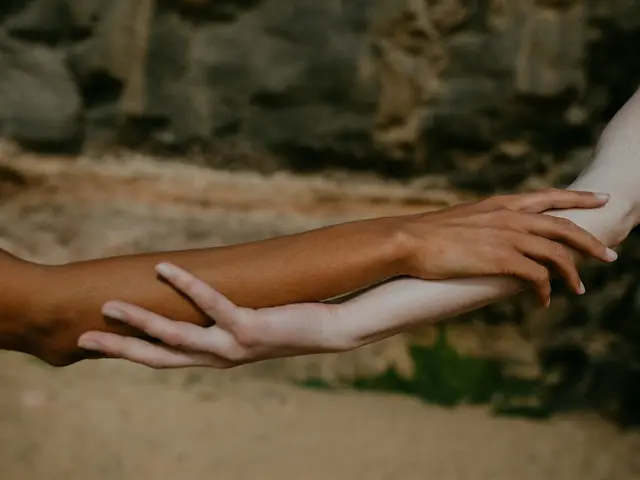Two hands resting together
